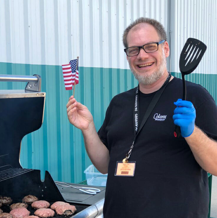 Employee grilling burgers